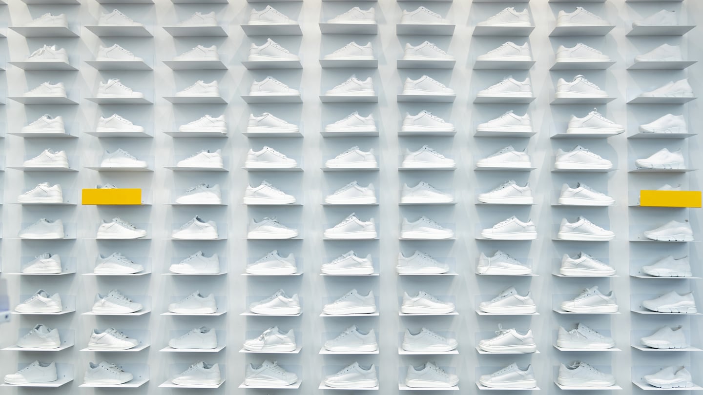 Wall of white sneakers.