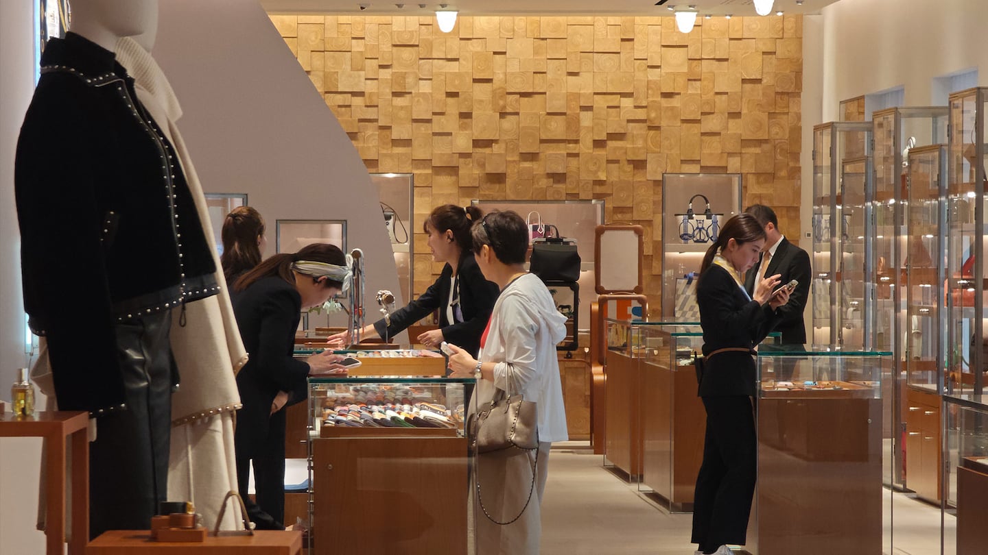 Customers shop for luxury goods at the Hermès flagship store in Shanghai, China, on September 26, 2024.